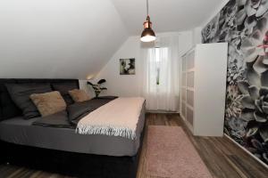 a bedroom with a bed in a room at Apartment Am Stadtwald in Werne an der Lippe / NRW in Werne an der Lippe