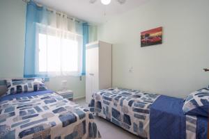 Posteľ alebo postele v izbe v ubytovaní Alegria ID24