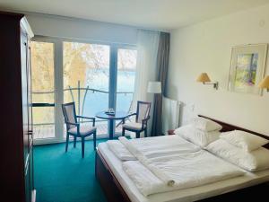 Postel nebo postele na pokoji v ubytování SZIGET HOTEL VERÁNKA