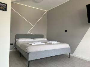 Ein Bett oder Betten in einem Zimmer der Unterkunft Corridoni33 - Immobili e Soluzioni Rent