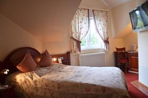 Postel nebo postele na pokoji v ubytování Hotel Mühle