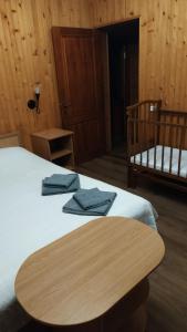Postel nebo postele na pokoji v ubytování Eco Sadyba Chertizh