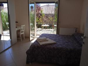 Posteľ alebo postele v izbe v ubytovaní L'elicriso B&B