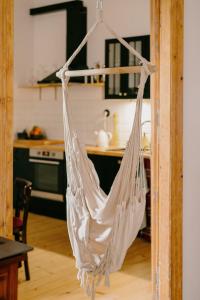 a white hammock hanging in a kitchen at 4ry pokoje in Cieszyn