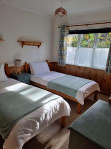 Postel nebo postele na pokoji v ubytování River Edge Lodges
