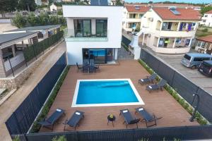 an overhead view of a swimming pool on a house at Villa Tuta with heated pool, only 150 m from the beach in Pakoštane