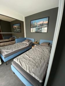 Postel nebo postele na pokoji v ubytování Kertvárosi Apartmanok