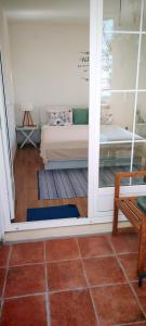 a view of a living room with a couch through a door at Guesthouse Alliya in Dubrovnik