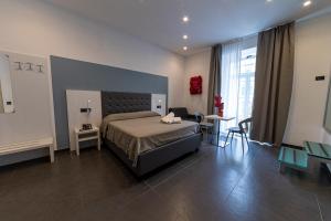 Postel nebo postele na pokoji v ubytování Residenza San Lorenzo + 37 fotografií