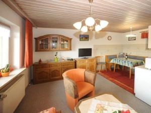 a living room with a kitchen and a dining room at Holiday apartment Sonnenfels I in Bodenmais