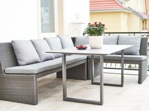 a couch and a table on a patio at Holiday apartment Villa PRIMERA in Singen