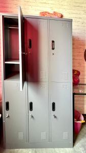 two metal lockers with a pizza on top of them at Iconic Athens Hostel in Athens