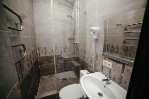 a bathroom with a toilet and a sink at Mini Hotel on Saydasheva in Kazan