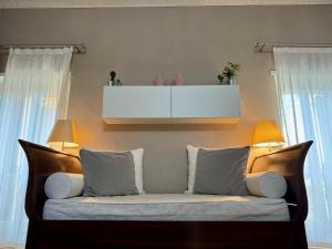 Posteľ alebo postele v izbe v ubytovaní Domus Suites Verona
