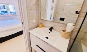 a bathroom with a sink and a shower at Your dream Getaway Awaits in Vale do Lobo in Almancil
