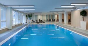 a large swimming pool in a large office building at Clarion Congress Hotel Ostrava in Ostrava