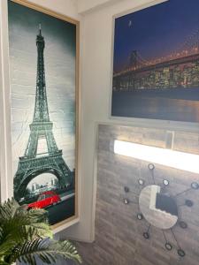 a picture of the eiffel tower on a wall at HOTEL DU CHATEAU in Paris