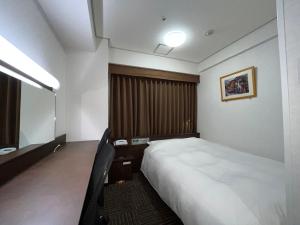 Postel nebo postele na pokoji v ubytování Hotel Alpha-One Yonago