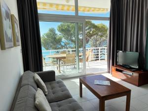 A television and/or entertainment centre at Agi Residencial Almadraba