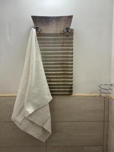 a towel hanging on a towel rack in a bathroom at La Casetta - Typical Guest House in Fasano