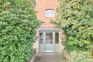 a building with a green door in front of it at Host & Stay - Roper Road in Canterbury