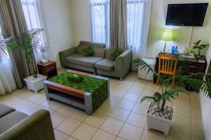 a living room with a couch and a coffee table at One Click Hotel in Kigali