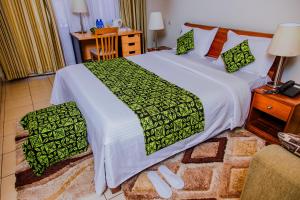 Postel nebo postele na pokoji v ubytování One Click Hotel