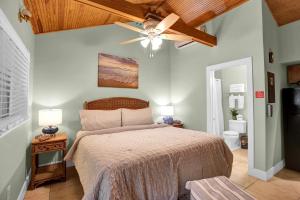 a bedroom with a bed and a ceiling fan at Coconut Mallory Resort and Marina in Key West +67 photos