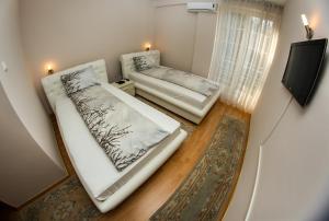 Postel nebo postele na pokoji v ubytování Hotel Fontana