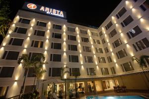 a hotel with a sign on the front of it at ARISTA BY AMBITION in Guwahati