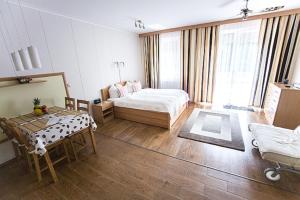 Posteľ alebo postele v izbe v ubytovaní Atmoszféra Apartman + 37 fotografií