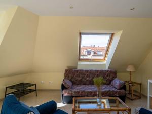 a living room with a couch and a window at Apartment Edificio Bahia II by Interhome in Miño