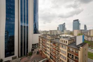 an aerial view of a city with tall buildings at Comfy Flat in the City Center in Warsaw