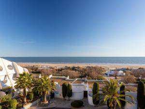 a view of the beach from the balcony at Apartment La Calypso-6 by Interhome in La Grande-Motte +32 photos