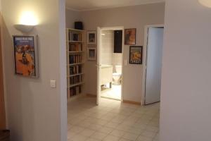 a room with a hallway with a door and a bathroom at Casa Charlotte nel cuore di Cannes in Cannes