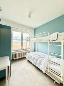 A bed or beds in a room at Phebus 0101 - Vue Mer