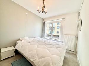 A bed or beds in a room at Phebus 0101 - Vue Mer