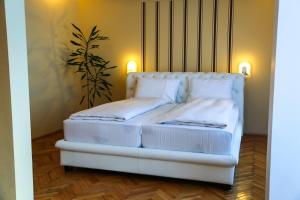Postel nebo postele na pokoji v ubytování Hotel Fontana