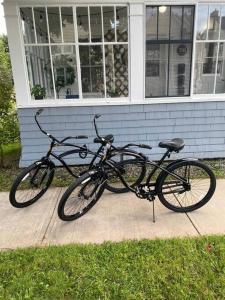 two bikes parked in front of a house at Spin & Sip - Dog-Friendly Vinyl Vibes Downtown in Fredericton