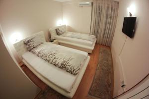 Postel nebo postele na pokoji v ubytování Hotel Fontana