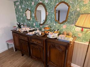a buffet with food on it in a room at Les Bruyeres Chambres dhotes et Gite in Verteuil-sur-Charente
