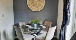 a dining room with a table with chairs and a mirror at New - Modern Home from Home, 3 bedrooms, 2.5 bath in Plymouth
