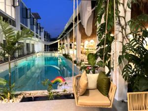 a pool on the side of a building at Diving Addiction Resort in Panglao Island