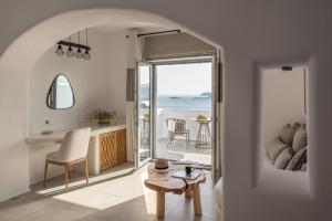 a living room with a view of the ocean at Virtu on the Hill in Stelida