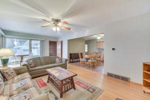 a living room with a couch and a table at Waterfront Lake Holcombe Getaway with Dock in Conrath