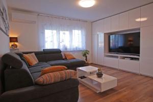 TV a/nebo společenská místnost v ubytování House Bonita