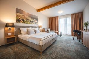Postel nebo postele na pokoji v ubytování Hotel Kaskáda