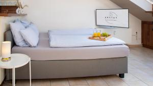 a bed with a tray on top of it in a room at Schöne gemütliche Wohnung in Marl in Marl