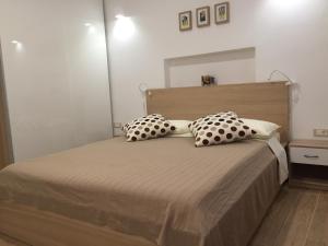 a bedroom with a bed with two pillows on it at Apartment Remy in Pula