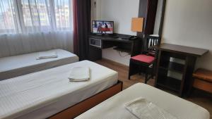 Postel nebo postele na pokoji v ubytování Arion Hotel